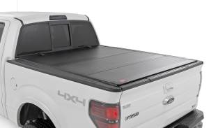 Rough Country - Rough Country Hard Tri-Fold Flip Up Bed Cover - 5'7" Bed - Ford F-150 (04-14) - 49214550 - Image 1